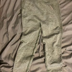 Gymshark light green leggings with pink logo.